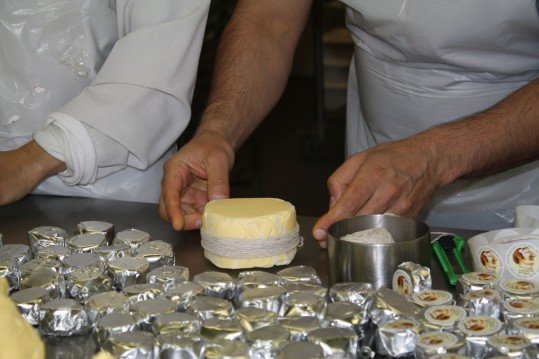 Image of a round of butter being made